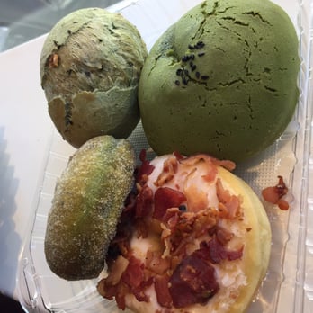 Cafe Dulce - Starting bottom left to top right: green tea donut, bacon donut, Dino egg, green tea roti - Coffee & Tea Near Me - Los Angeles, California