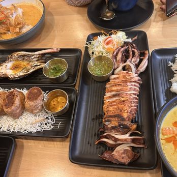 Manaao - Curry with Fried Catfish, Grilled River Prawn, Shrimp Cake Rolls, Yellow Curry with Shrimp, grilled squid, and Crispy Pork Belly - Thai Near Me - Tustin, California