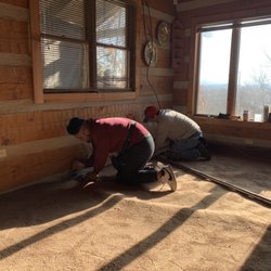 Phil's Carpets & Flooring - Axel and Roberto preparing to stretch the carpet