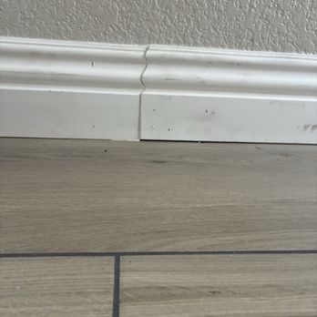 Promedia - Uneven baseboards no caulk no holes covered - Flooring Near Me - Chino, California