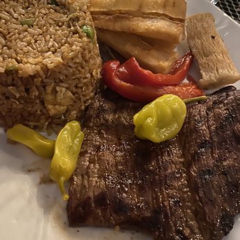 Acuario - Bistec a la parilla (dinner) with fried rice and yuca frita - Peruvian Near Me - Stamford, Connecticut Acuario - Bistec a la parilla (dinner) with fried rice and yuca frita - Peruvian Near Me - Stamford, Connecticut