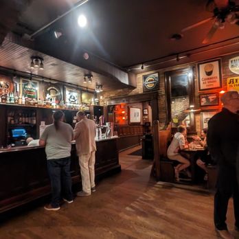 McGurk's - a group of people at a bar - Pubs Near Me - Saint Louis, Missouri