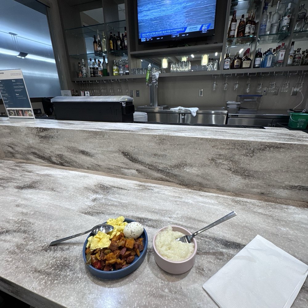 Escape Lounges - The Centurion Studio Partner - Bar seating area - typical breakfast selections 2/12/26 - Airport Lounges Near Me - Burlington, Kentucky Escape Lounges - The Centurion Studio Partner - Bar seating area - typical breakfast selections 2/12/26 - Airport Lounges Near Me - Burlington, Kentucky