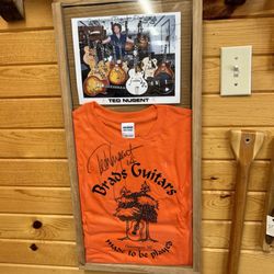 Nonesuch Gallery - Ted Nugent sign tshirt. Photo with Brads guitars.
