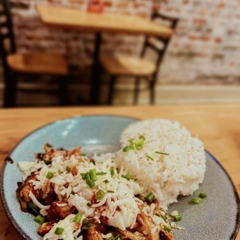 Bonchon Norfolk - a plate of food with rice and meat - Chicken Wings Near Me - Norfolk, Virginia