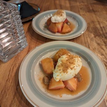 Bonheur d'Occasion - two plates of food on a table - Cafes Near Me - Montreal, Quebec Bonheur d'Occasion - two plates of food on a table - Cafes Near Me - Montreal, Quebec