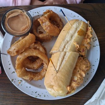 Gnats Landing - Philly steak sandwich with pimento cheese and onion rings and spicy sauce - Seafood Near Me - Statesboro, Georgia Gnats Landing - Philly steak sandwich with pimento cheese and onion rings and spicy sauce - Seafood Near Me - Statesboro, Georgia