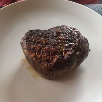 Prime - 12 oz filet mignon just tossed on the plate with no garnish - American Near Me - Huntington, New York Prime - 12 oz filet mignon just tossed on the plate with no garnish - American Near Me - Huntington, New York