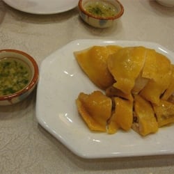 名苑酒家 - Hainanese chicken rice is a dish adapted from early Chinese immigrants originally from the Hainan province in southern China.