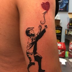Blue Fin Tattoo and Piercing - Banksy inspired tattoo