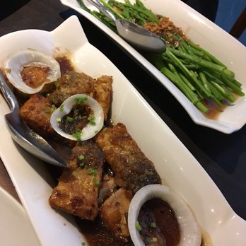 Mesa Filipino Moderne - Sautéed fish in soy sauce and lemon, topped with sliced onions. Asparagus tips sautéed in garlic sauce - Restaurants Near Me - Mandaluyong, NCR