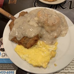 Chicken fried steak eggs and biscuit with gravy