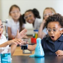 REACH Leadership STEAM Academy - Reach scholars conducting a science experiment