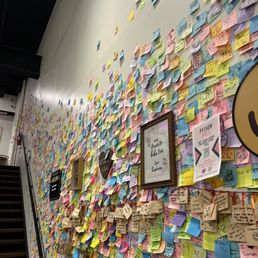 a wall covered with post it notes
