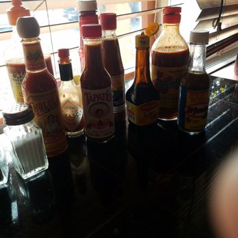 Los Toritos 2 - All the hot sauce choices at the table - Mexican Near Me - Aurora, Colorado