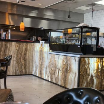 Chef's Table Mediterranean Grill - Backlit quartz service bar. - Mediterranean Near Me - Webster, Texas Chef's Table Mediterranean Grill - Backlit quartz service bar. - Mediterranean Near Me - Webster, Texas