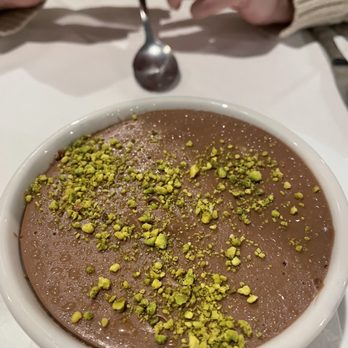 Artemis Mediterranean Bistro - Scrumptious chocolate pudding with Pistachios and almonds - Mediterranean Near Me - Cincinnati, Ohio Artemis Mediterranean Bistro - Scrumptious chocolate pudding with Pistachios and almonds - Mediterranean Near Me - Cincinnati, Ohio
