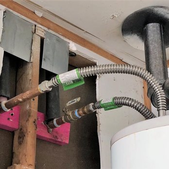 We Do Repipes - Water heater reconnected with new supply lines and shutoffs after the repipe. - Plumbing Near Me - Houston, Texas We Do Repipes - Water heater reconnected with new supply lines and shutoffs after the repipe. - Plumbing Near Me - Houston, Texas