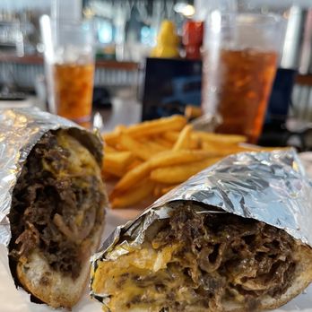 Waterfront Social - Philly cheesesteak sandwich - Bars Near Me - Crystal River, Florida Waterfront Social - Philly cheesesteak sandwich - Bars Near Me - Crystal River, Florida