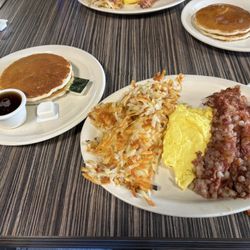 Tonys Cafe - 2 eggs, corned beef hash and hash browns, with pancakes instead of toast.