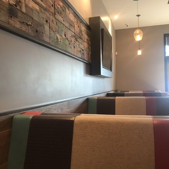 Luna Grill Cerritos - Frame big screen TV recycled wood patchwork booth  upholstery - Mediterranean Near Me - Cerritos, California