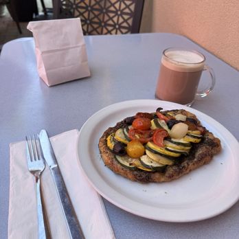 Dolce Caffe - Vegetable breakfast with a mocha made with almond milk alternative and in the little white bag is a pistachio cookie. - Breakfast & Brunch Near Me - Reno, Nevada