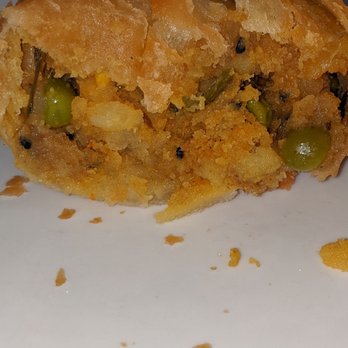 Karimi Restaurant - Cross section of vegetable samosa (One order = 2) - Indian Near Me - San Jose, California Karimi Restaurant - Cross section of vegetable samosa (One order = 2) - Indian Near Me - San Jose, California
