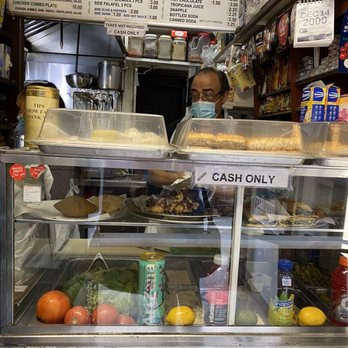 Rainbow Falafel - a woman behind the counter - Middle Eastern Near Me - New York, New York Rainbow Falafel - a woman behind the counter - Middle Eastern Near Me - New York, New York