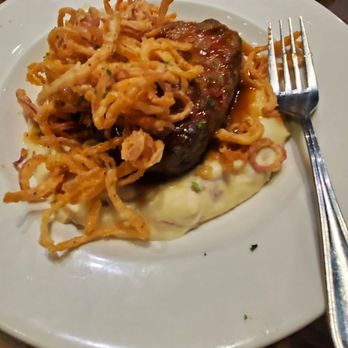 Local Goat - Bison meatloaf and onion straws over mashed potatoes - New American Near Me - Pigeon Forge, Tennessee