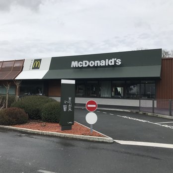 McDonald's - Exterior, plenty of parking. Yes, they have a drive-thru. - Fast Food Near Me - Poussan, 24