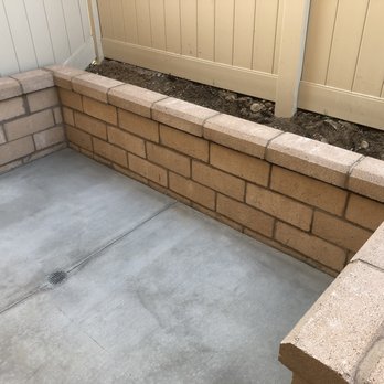Del Rio Landscape - Concrete area for trash cans an retaining wall (concrete still curing) - Landscaping Near Me Del Rio Landscape - Concrete area for trash cans an retaining wall (concrete still curing) - Landscaping Near Me