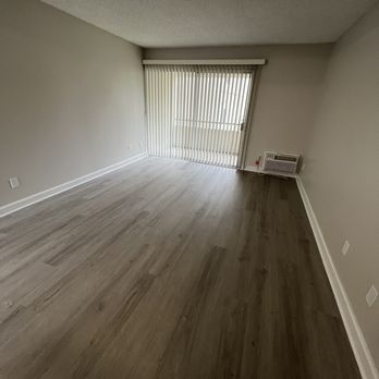 Brookwood Apartments - Living room lot of room and Ac and big balcony - Apartments Near Me - Covina, California