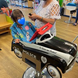 Sitting like a big boy getting a trim! Yolanda at Kidsnips Wilmette is great!