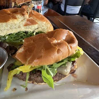 The Hangry Bison - Regular patty (med-well by request) pepper jack cheese, arugula, banana peppers, house made pickles, with 3 sauces on the side. - New American Near Me - Winter Park, Florida The Hangry Bison - Regular patty (med-well by request) pepper jack cheese, arugula, banana peppers, house made pickles, with 3 sauces on the side. - New American Near Me - Winter Park, Florida