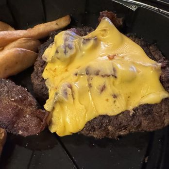 Texas Roadhouse - My To-Go Bacon Cheeseburger thrown in with the fries(I uncovered it-had fries on top of it) - Steakhouses Near Me - Topeka, Kansas