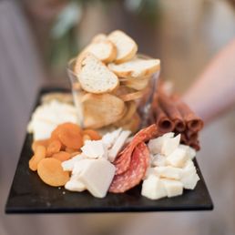 Assortment of cheeses and crackers as a welcome appetizer before the ceremony.