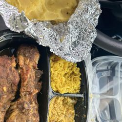 African Sister Restaurant - Top left - yellow rice Top right - egusi Bottom - curry/jerk chicken
