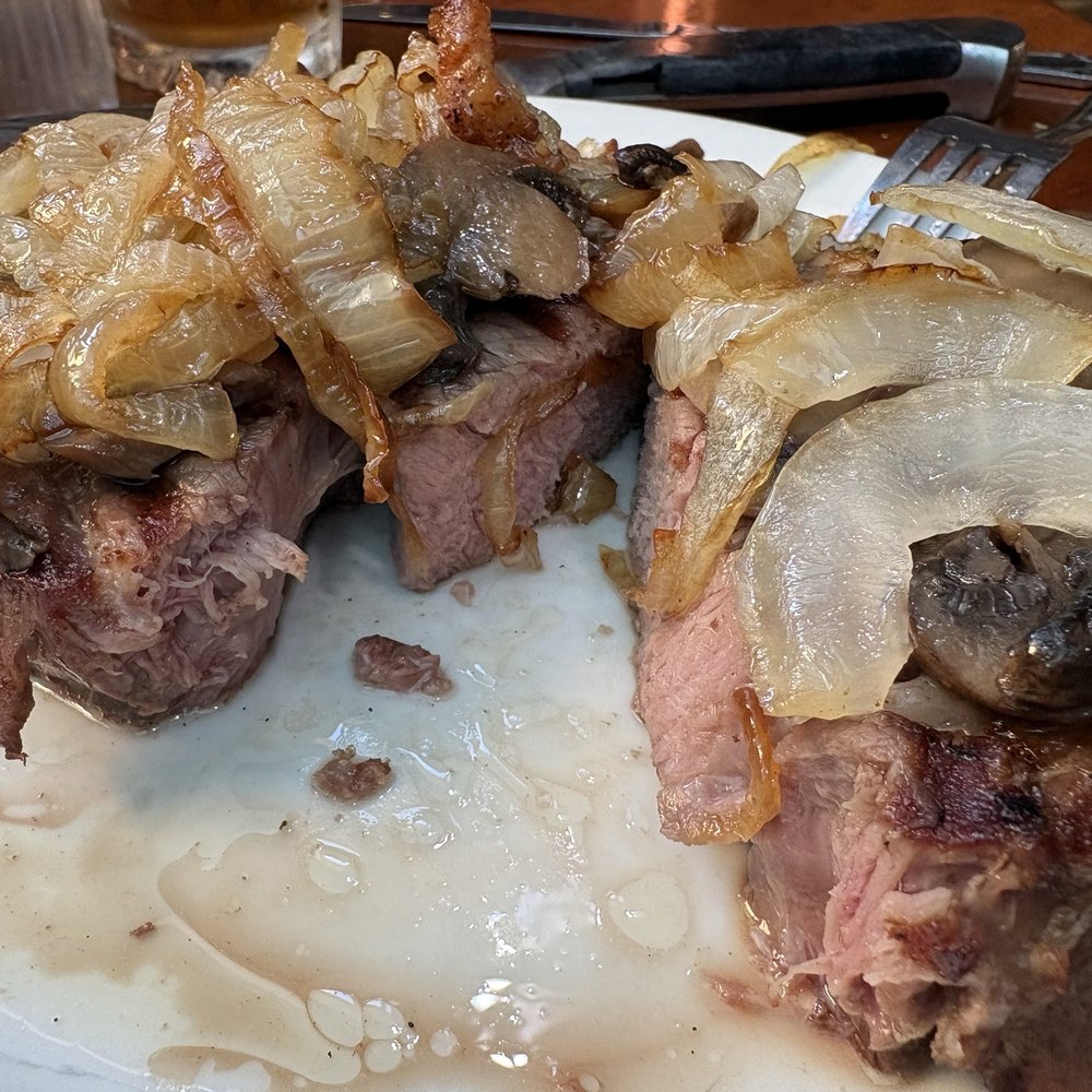 Arthur's Supper Club - Prime rib with grill marks, onions and mushroom topper - American Near Me - Spring Green, Wisconsin