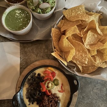 Bakersfield Mass Ave - The trio with Guac and salsas + loaded queso - Bars Near Me - Indianapolis, Indiana Bakersfield Mass Ave - The trio with Guac and salsas + loaded queso - Bars Near Me - Indianapolis, Indiana
