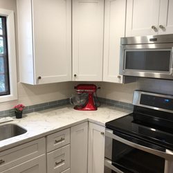 One Design Place - Roomy upper corner cabinet... Lower corner cabinet is a lazy Susan, making pot and pan organization so much easier!