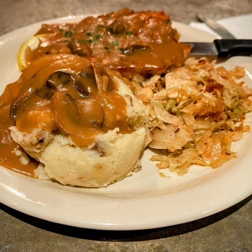 Prost - Jaeger Schnitzel with mashed potatoes and hot cabbage and bacon salad. Pro Tip: Get some extra Jaeger gravy for the mashed potatoes - German Near Me - San Antonio, Texas Prost - Jaeger Schnitzel with mashed potatoes and hot cabbage and bacon salad. Pro Tip: Get some extra Jaeger gravy for the mashed potatoes - German Near Me - San Antonio, Texas