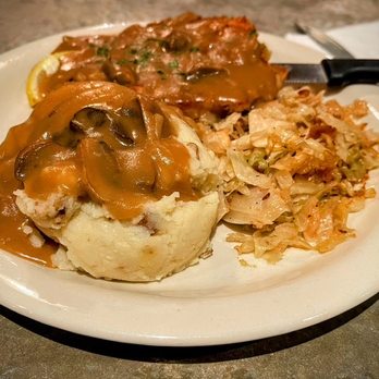 Prost - Jaeger Schnitzel with mashed potatoes and hot cabbage and bacon salad.  Pro Tip: Get some extra Jaeger gravy for the mashed potatoes - German Near Me - San Antonio, Texas