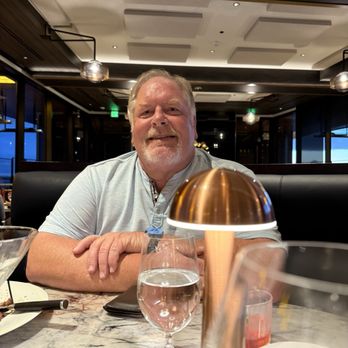 Smoke & Cedar Steakhouse - My husband enjoying a cocktail and appetizers - Steakhouses Near Me - Auburn, Washington Smoke & Cedar Steakhouse - My husband enjoying a cocktail and appetizers - Steakhouses Near Me - Auburn, Washington