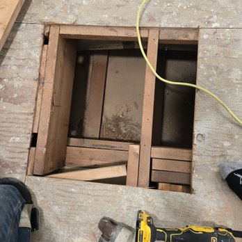 Darling Flooring - Jake fixing the hole. - Flooring Near Me