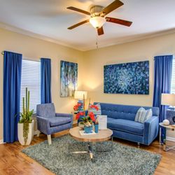 Pavilions at Northshore Apartment Homes - Living Room With Ceiling Fan