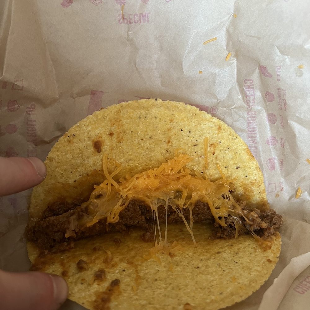 One of four tacos that had nothing but meat and cheese One of four tacos that had nothing but meat and cheese