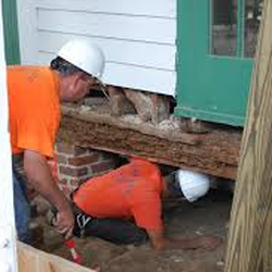 Atlas Construction and Foundation Repair - Atlas Construction and Foundation repair crews repair a home