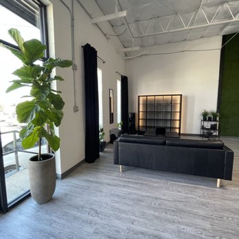 Ear Hustlaz Studios - a living room with a large window - Venues & Event Spaces Near Me - Dallas, Texas