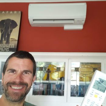 Ocean Air Heating - Me with one of my new mini-split heater / A/C units and its remote. - Heating & Air Conditioning/HVAC Near Me Ocean Air Heating - Me with one of my new mini-split heater / A/C units and its remote. - Heating & Air Conditioning/HVAC Near Me