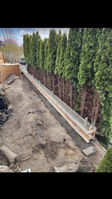 Elite Masonry and Drainage Logo